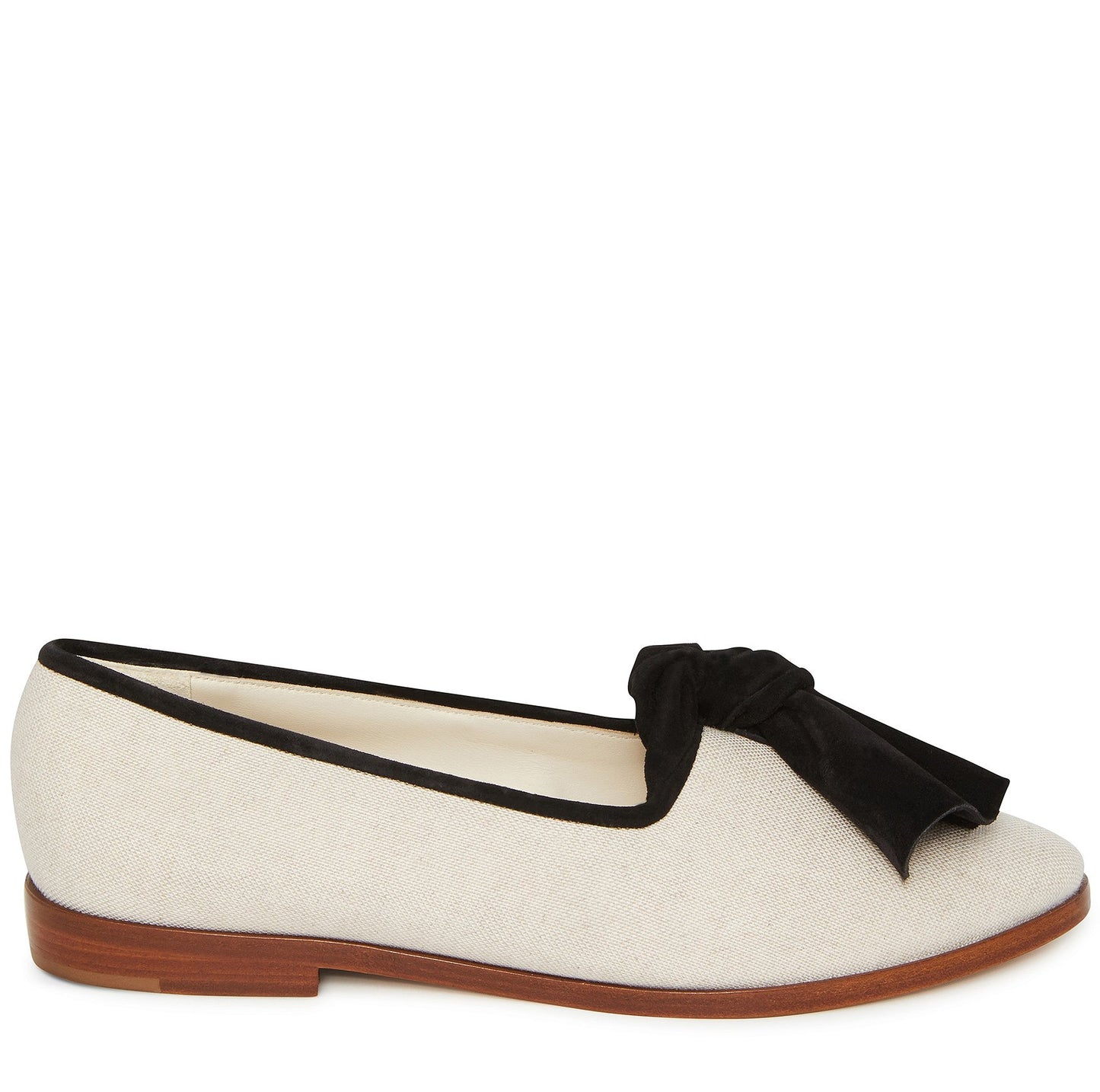 Italian cotton canvas creme flat with black suede bow and calf leather insole.