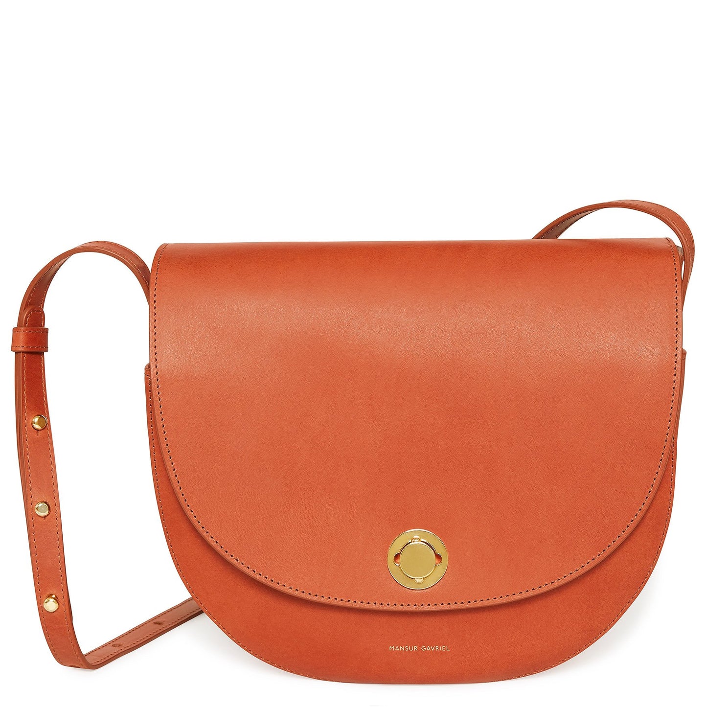 Italian vegetable tanned leather brandy saddle bag with two interior pockets and beige canvas interior.