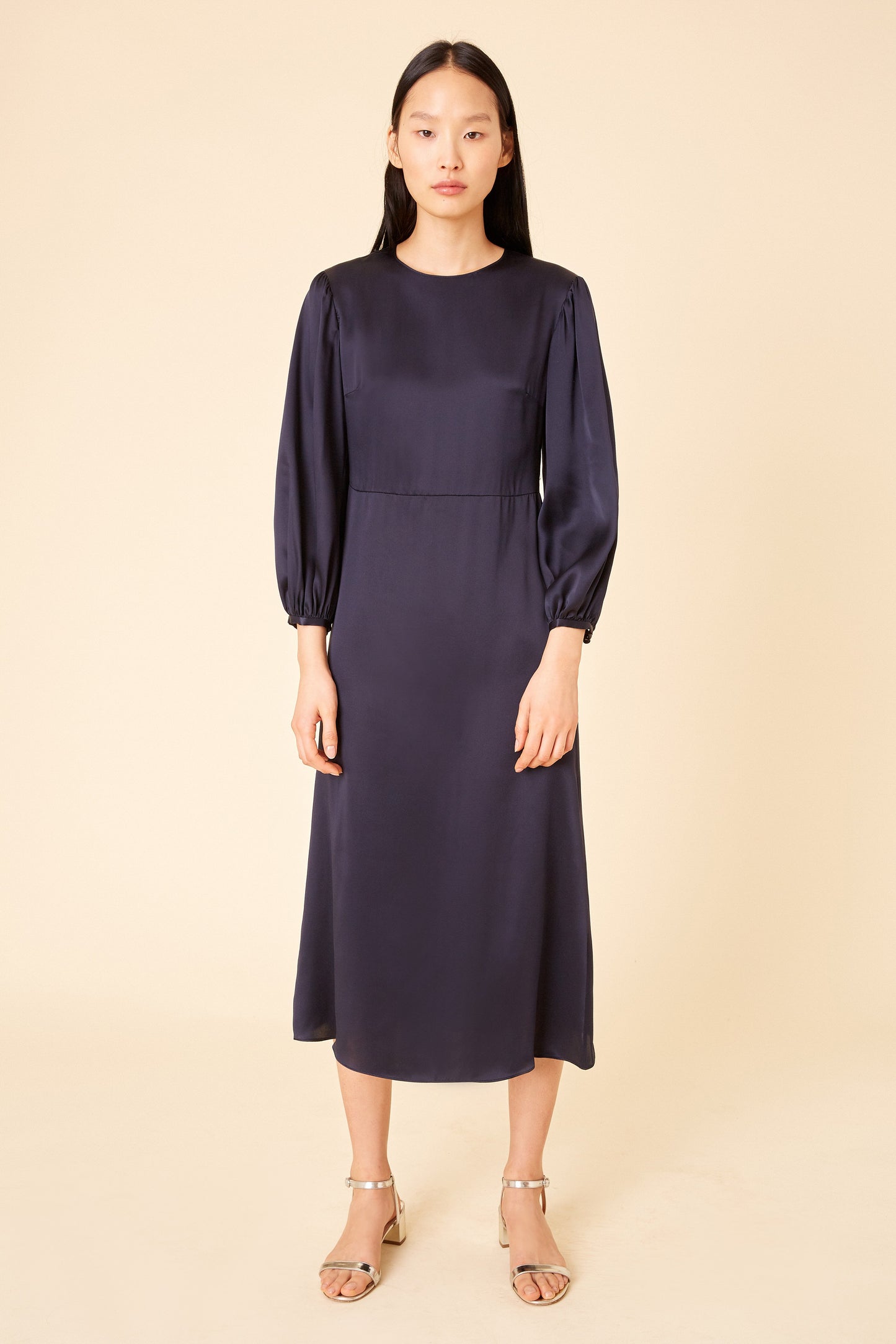 Italian silk charmeuse navy bishop sleeve dress.