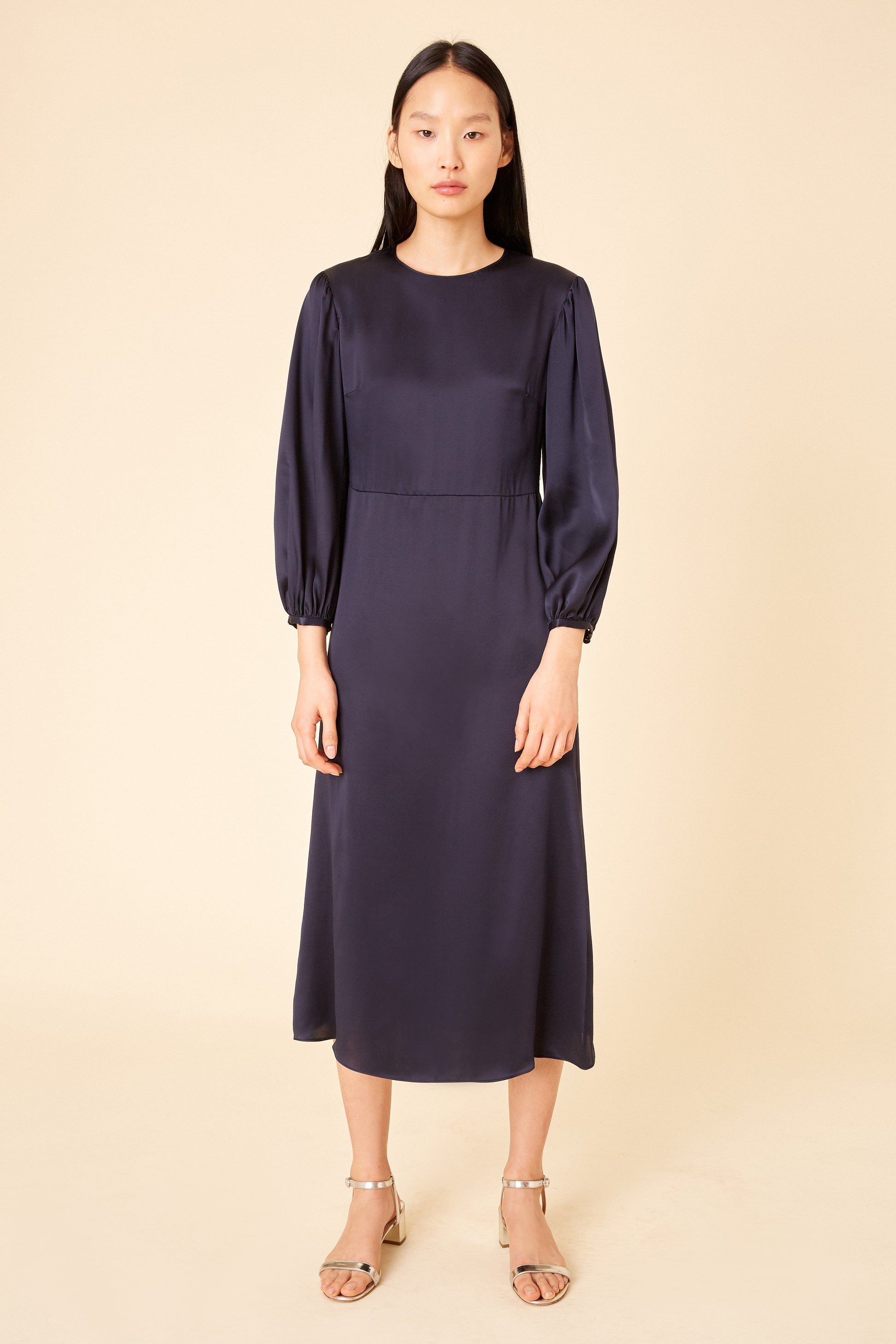 Italian silk charmeuse navy bishop sleeve dress.