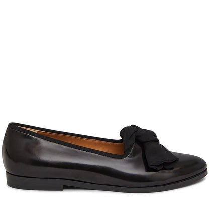 Italian spazzolato leather black flat with black grosgrain bow and calf leather insole.