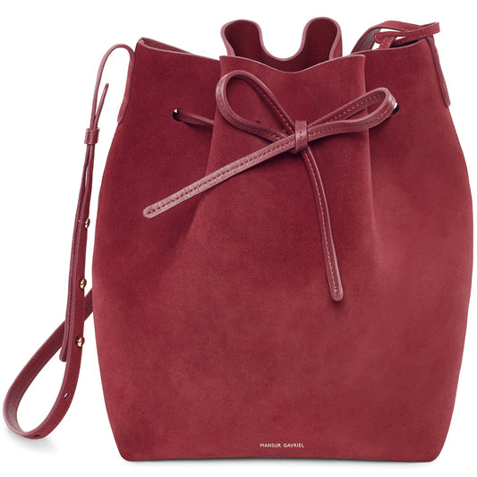 Italian suede leather rococo bucket bag with raw interior.