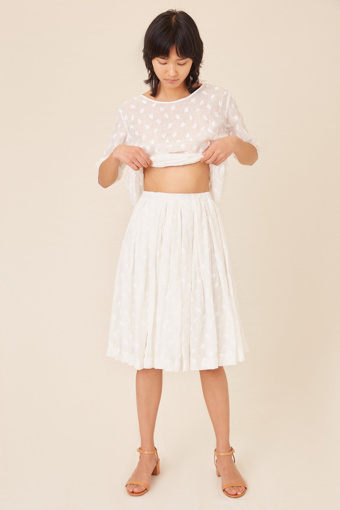 Italian floral embroidered white linen pleated skirt.