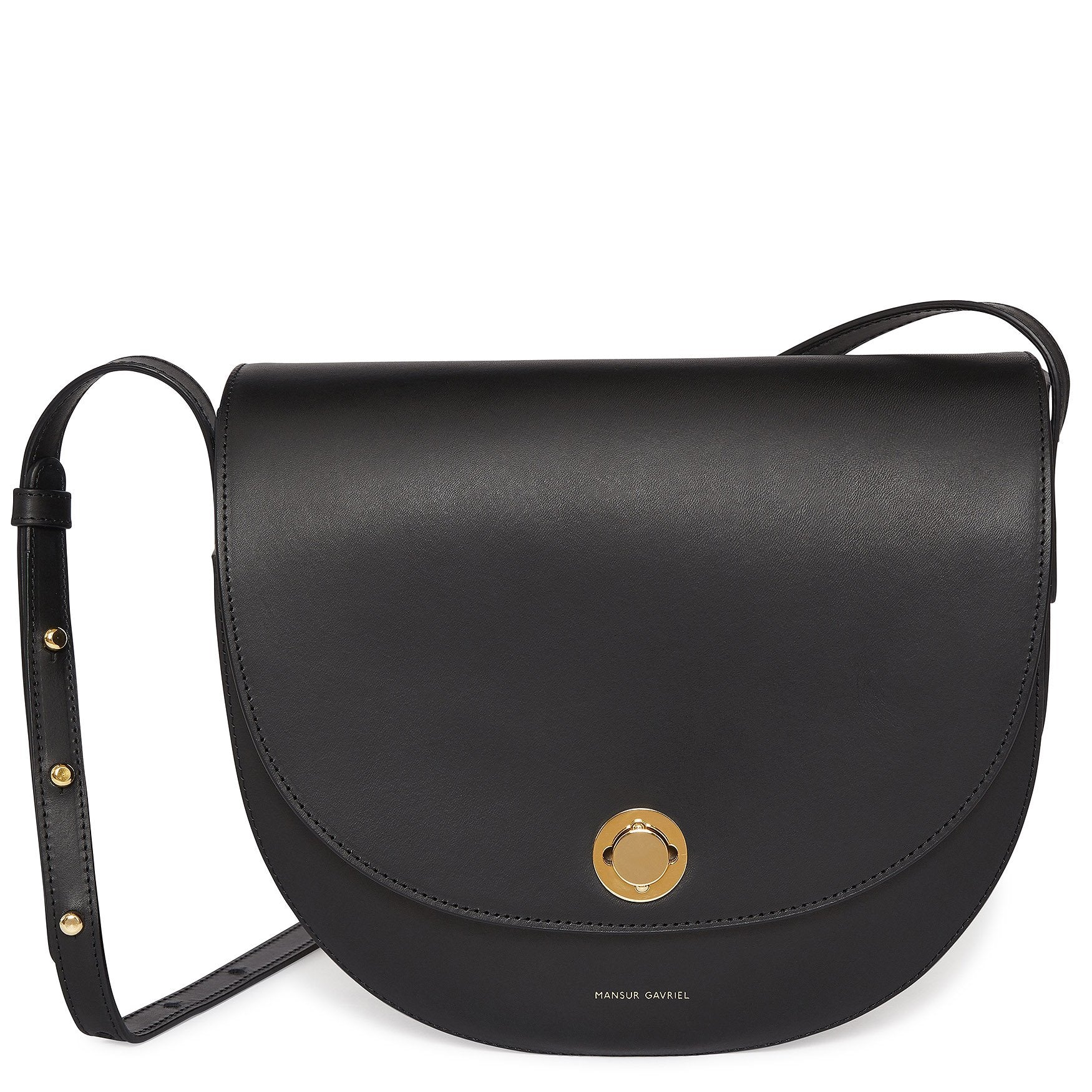 Italian vegetable tanned leather black saddle bag with two interior pockets and beige canvas interior.