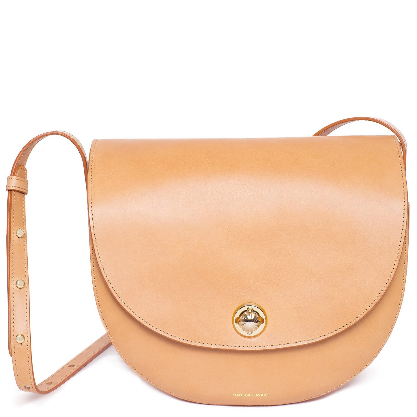 Italian vegetable tanned leather cammello saddle bag with two interior pockets and beige canvas interior.