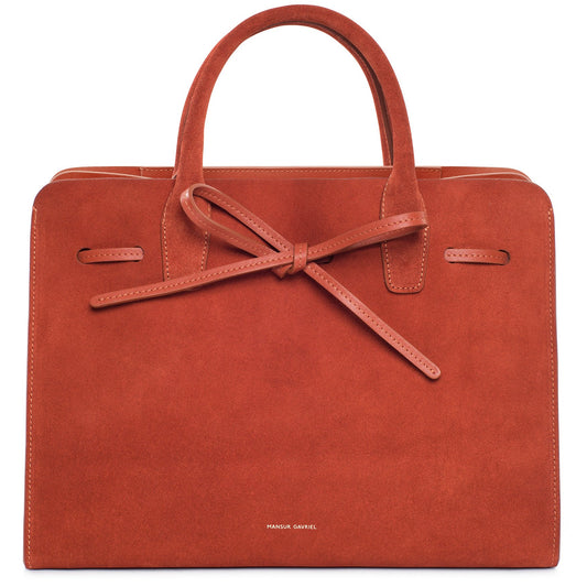 Italian suede leather rust sun bag with raw interior.